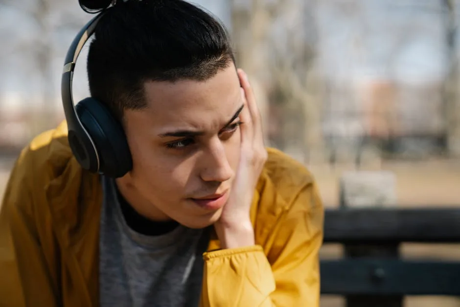 Close-up of wireless headphones placed on a wooden surface, perfect for tech and lifestyle themes.