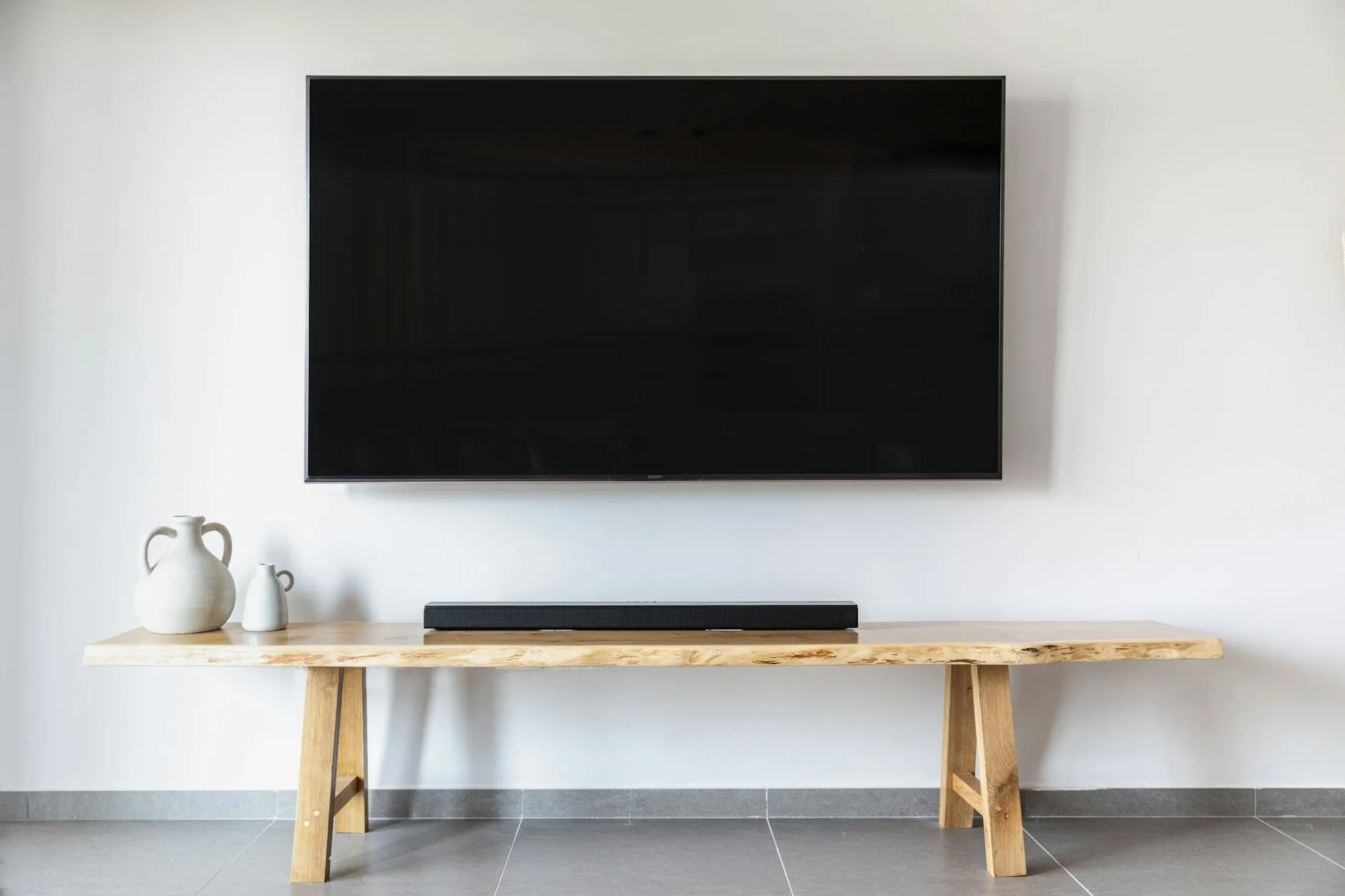 Soundbar beneath a television in a modern living room