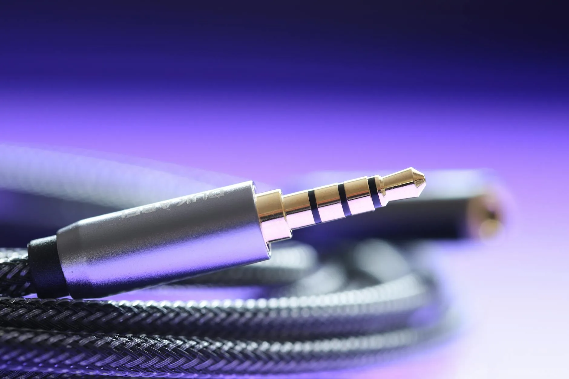 Over-ear headphones with audio cable close-up