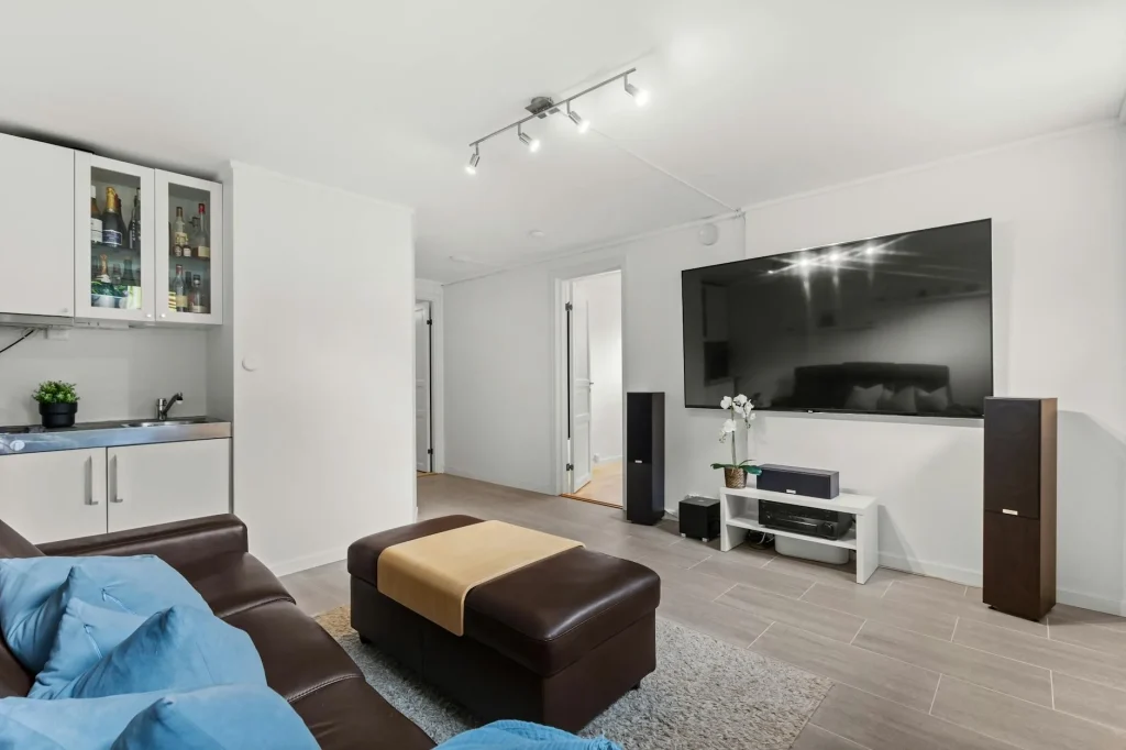 Home cinema setup in a living room with large screen TV