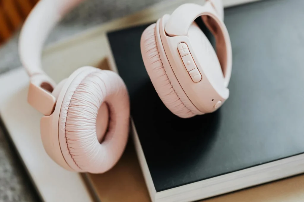 Premium over-ear wireless headphones resting on a modern desk