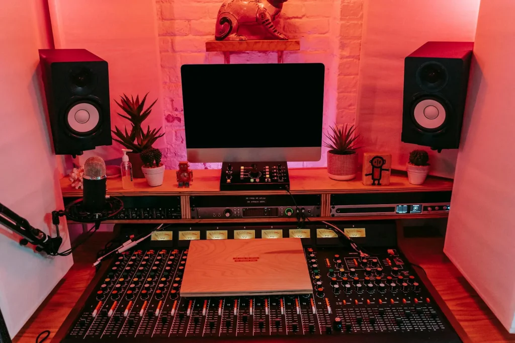 Home studio setup with monitors and acoustic treatment