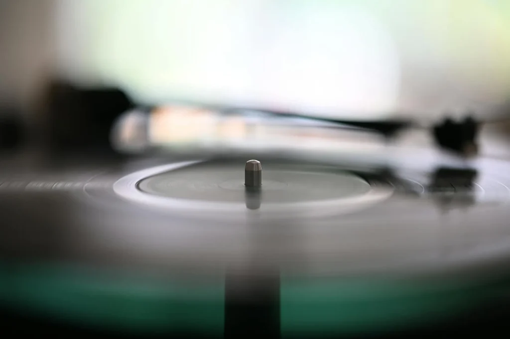 Turntable with stylus resting on a spinning vinyl record
