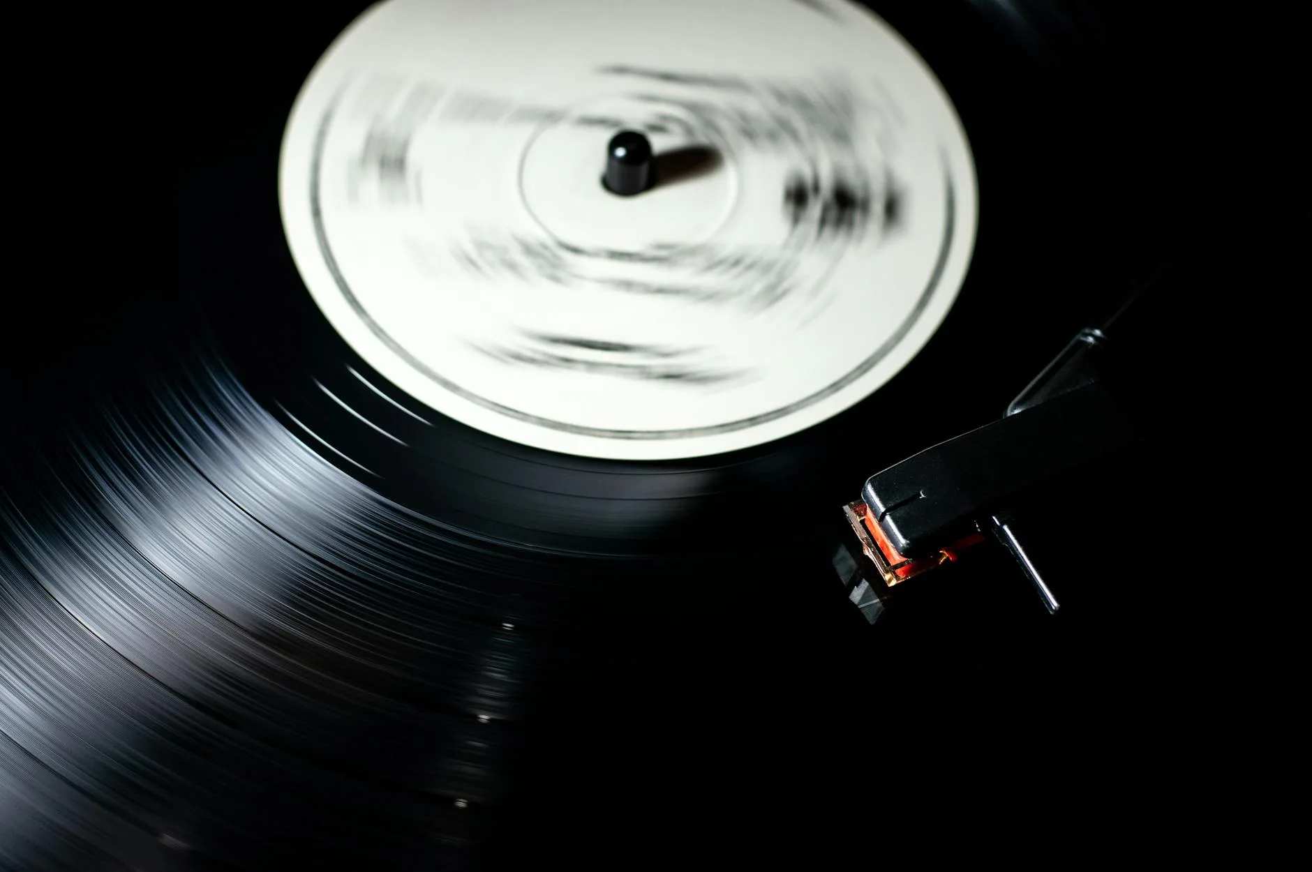 Close up of vinyl record on turntable with needle in groove