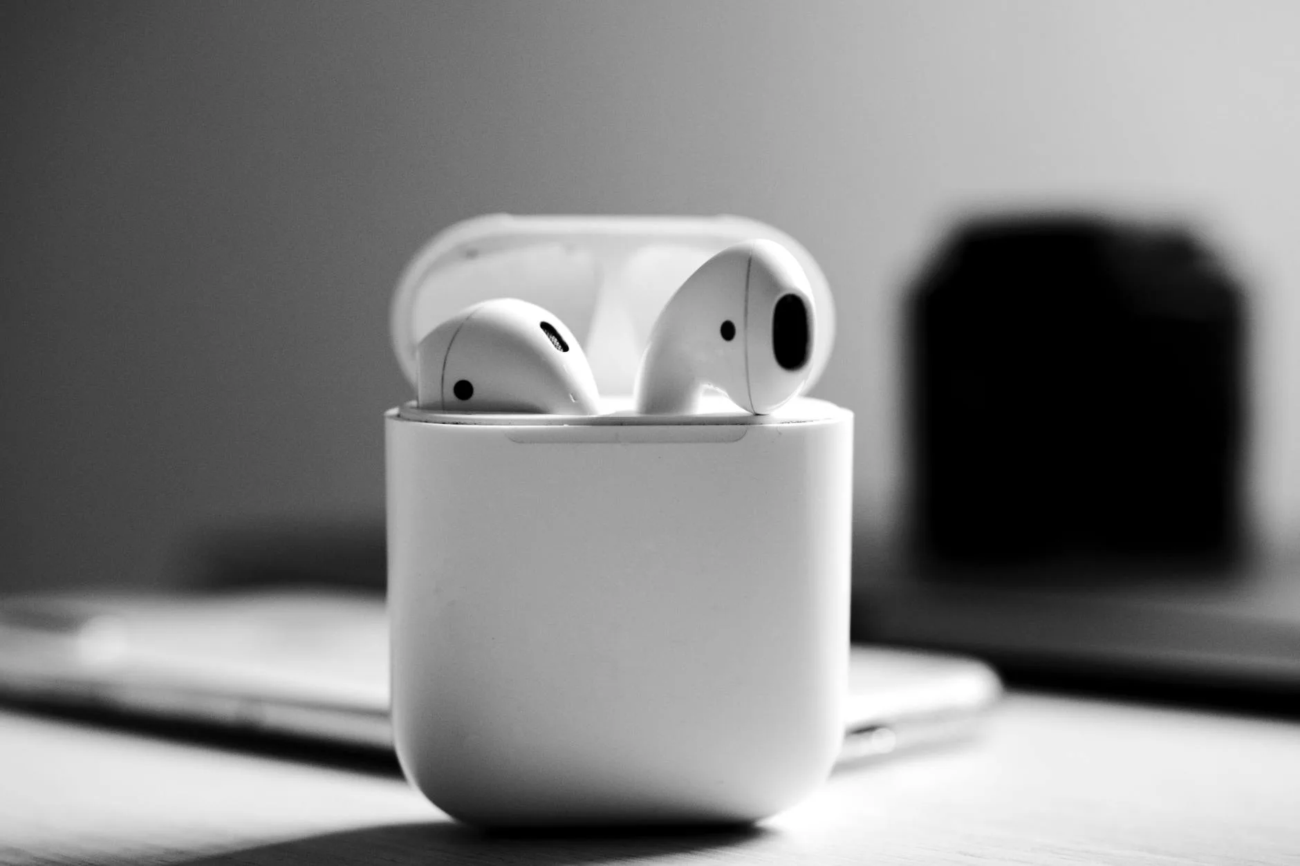 Wireless earbuds in charging case ready for running