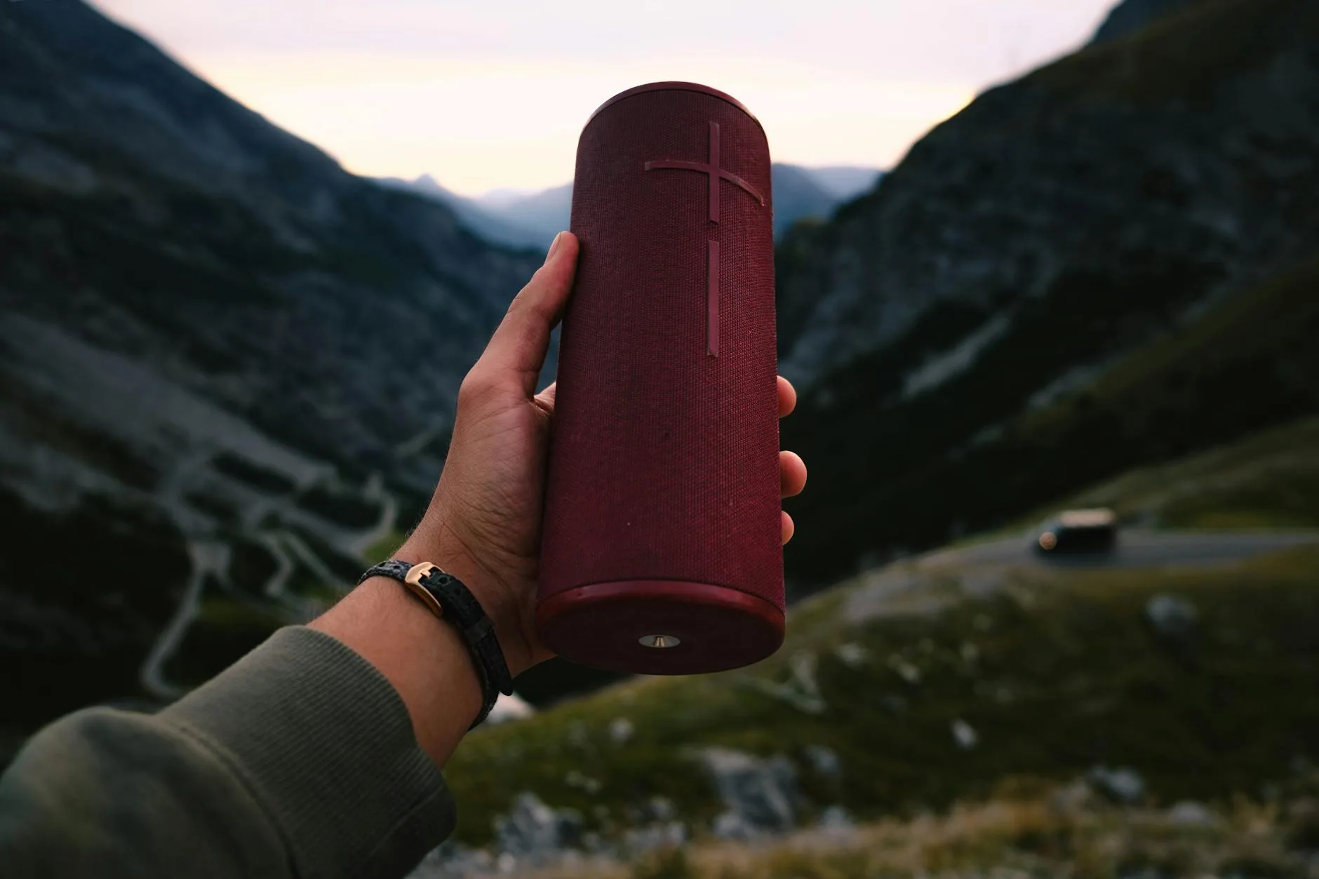 Portable Bluetooth speaker playing music outdoors