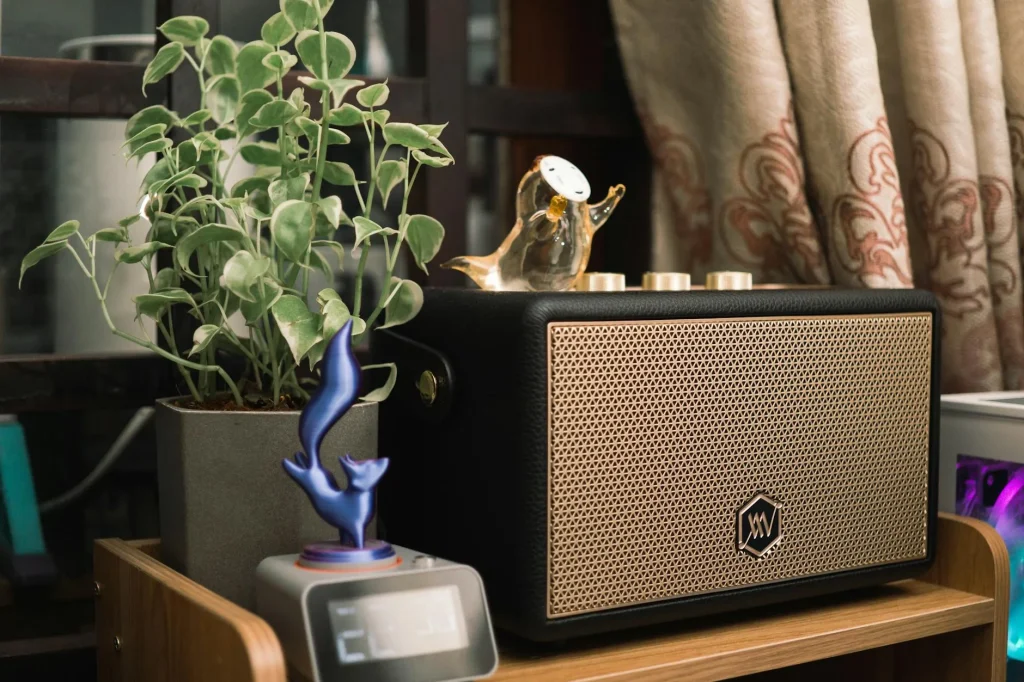 Wireless speaker on a shelf in a modern living room
