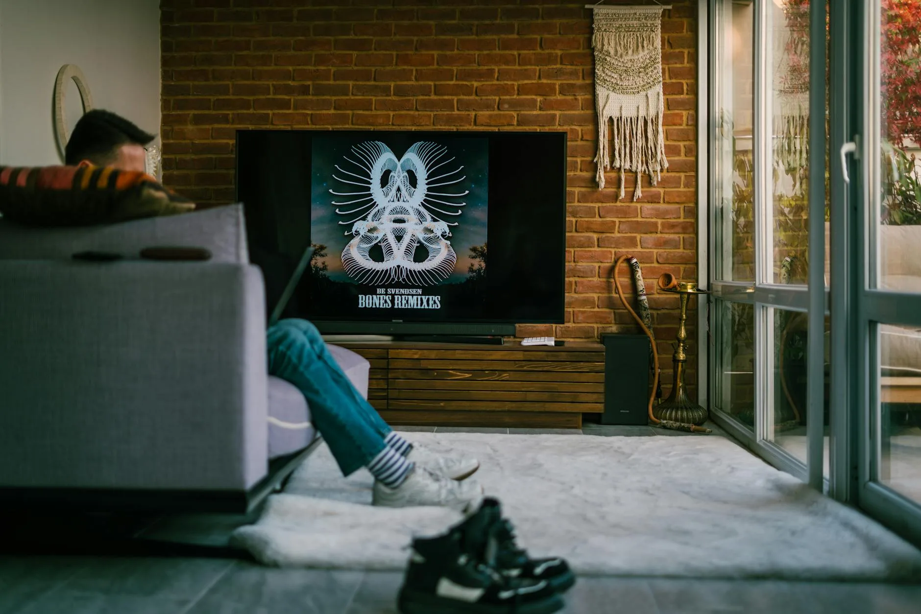 Soundbar mounted below a TV in a home cinema setup