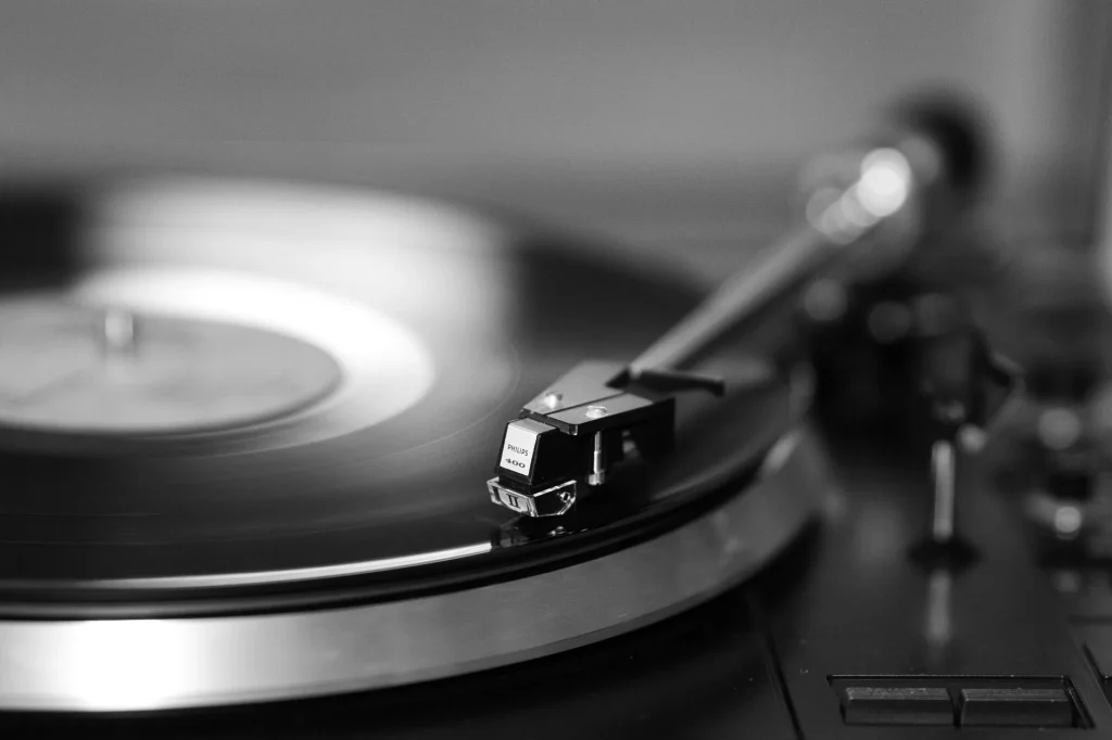 Turntable playing a vinyl record for belt drive vs direct drive comparison
