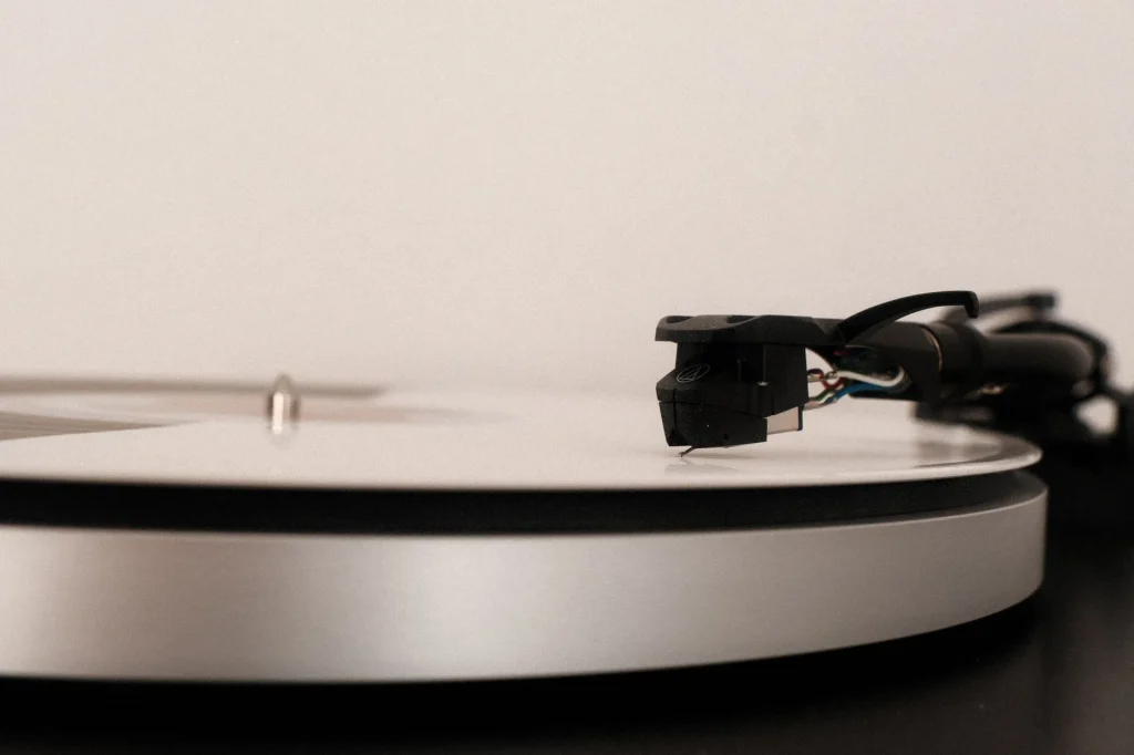 Turntable playing a vinyl record in a clean home audio setup