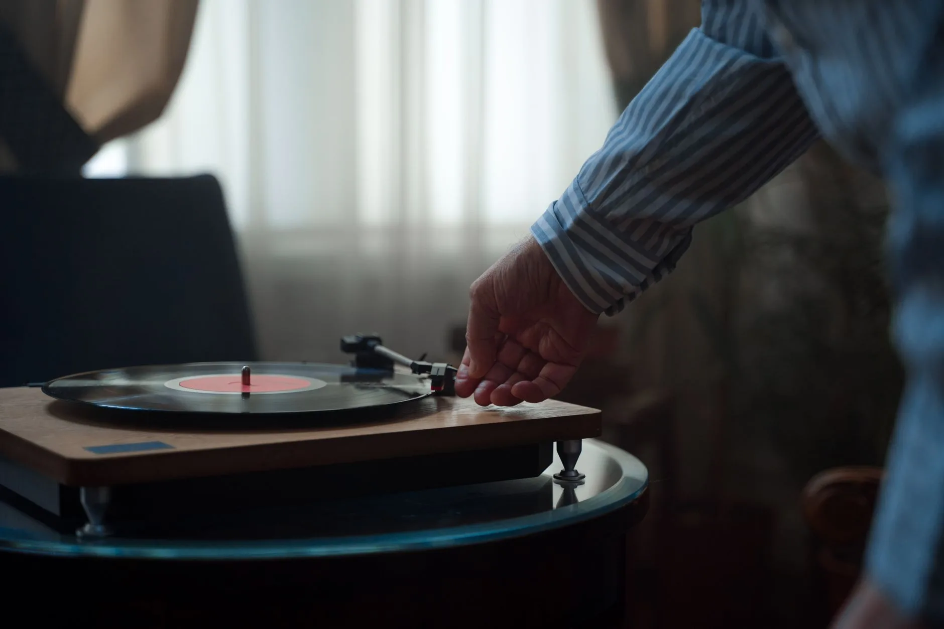 Turntable playing vinyl in a classic home hi-fi setup
