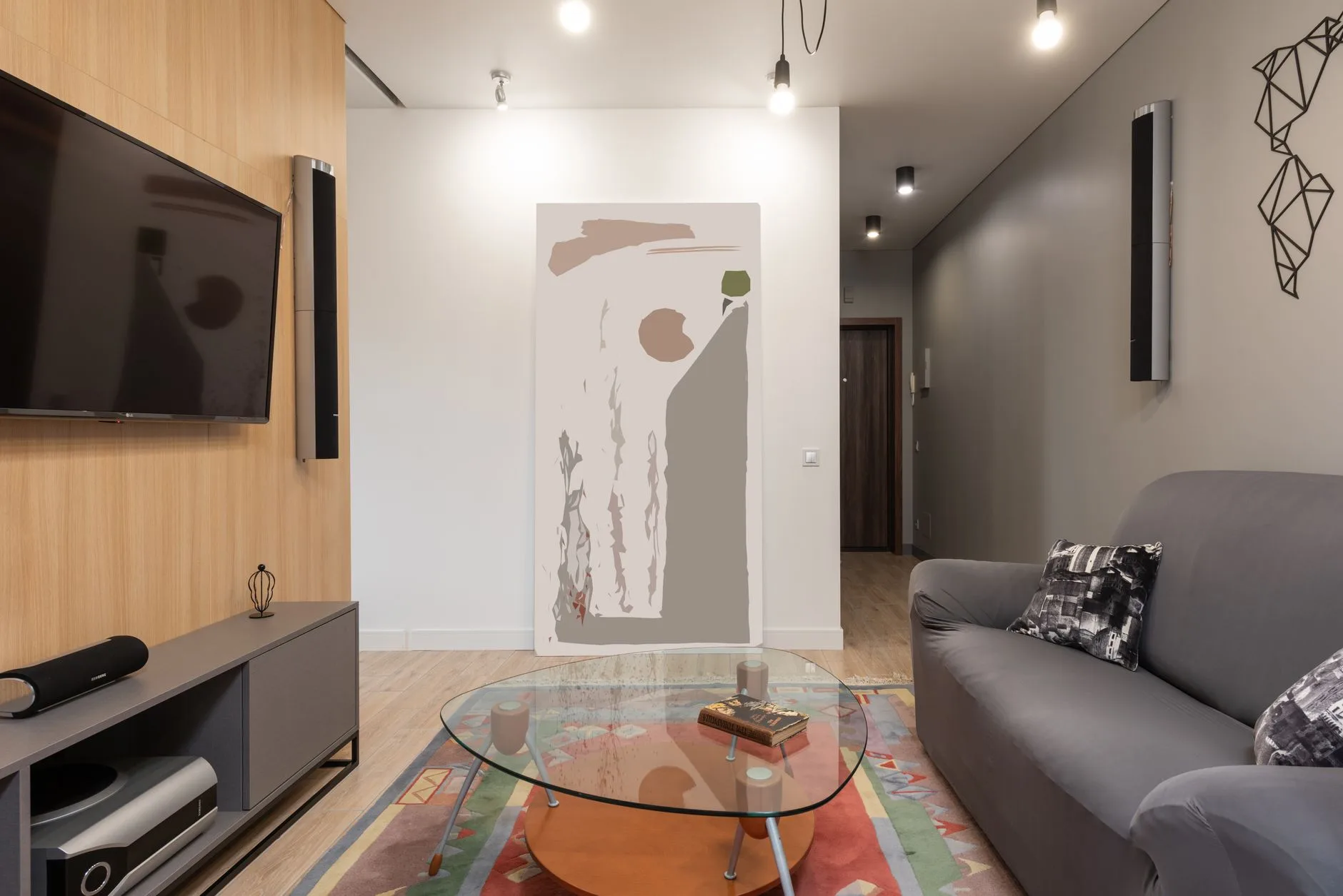 Subwoofer placed beside a home cinema cabinet