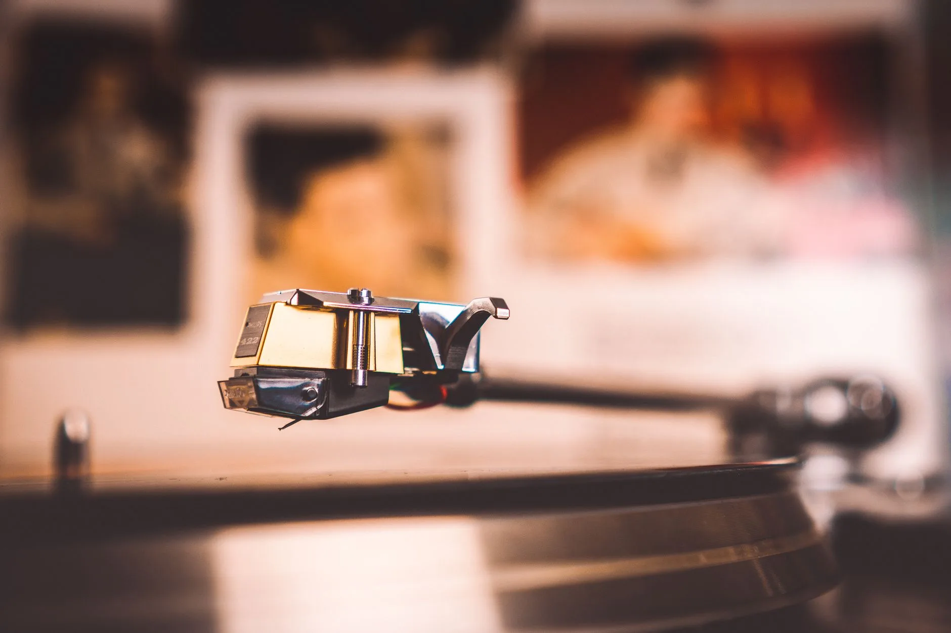 Close-up of a turntable cartridge and stylus on a headshell