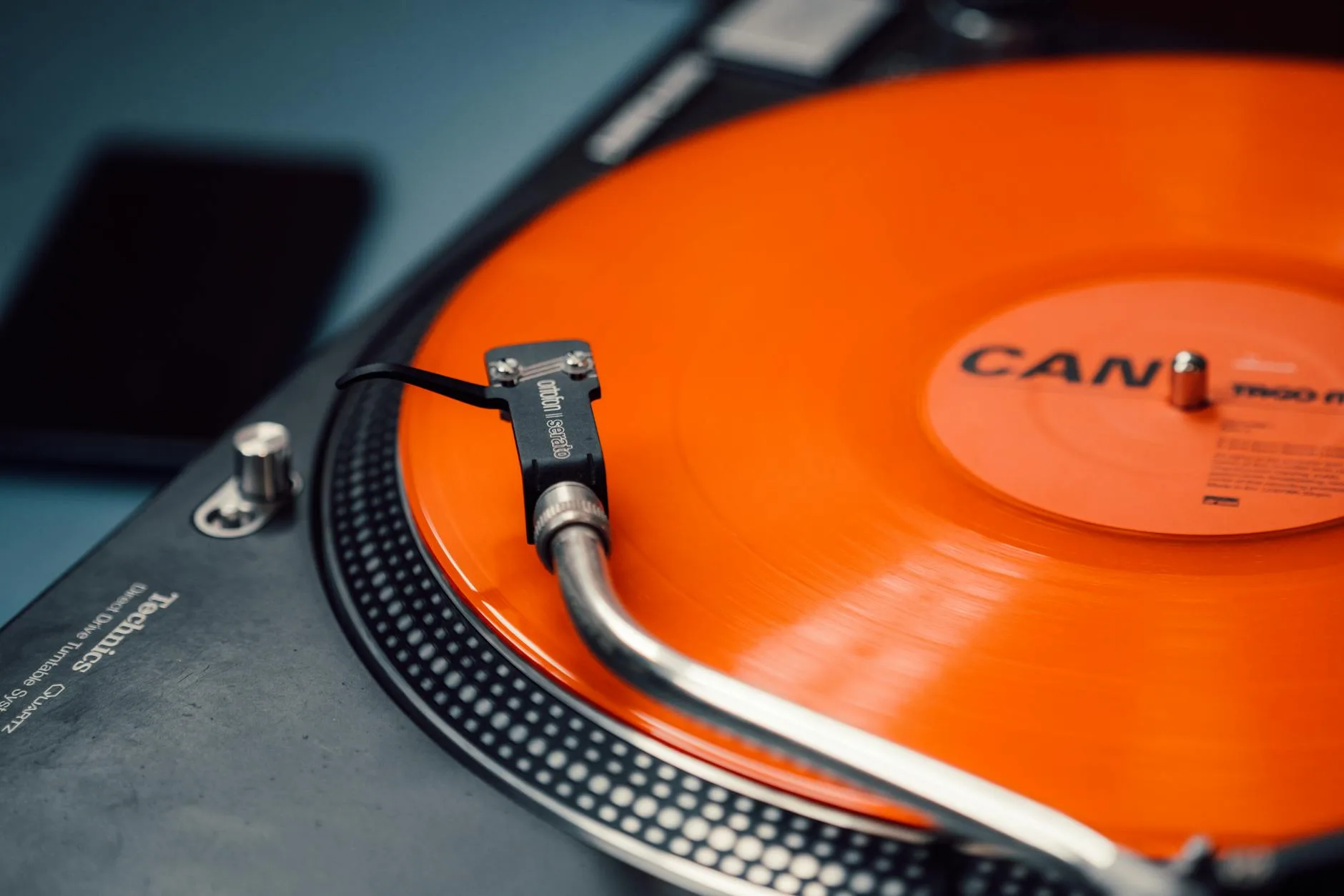 Turntable tonearm and stylus set over a vinyl record