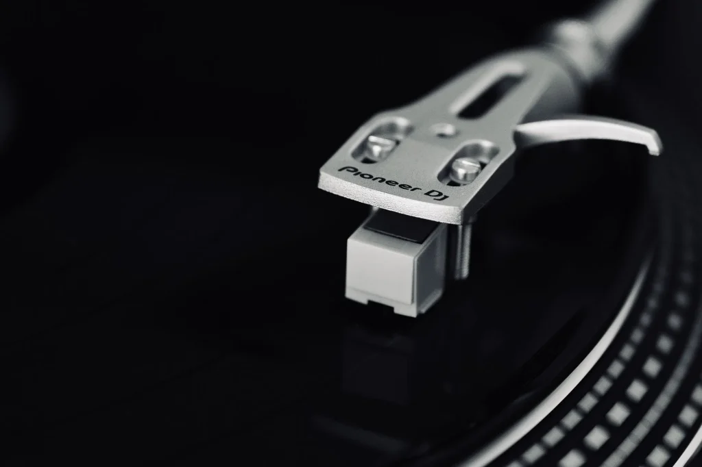 Turntable playing a vinyl record in a hi-fi setup