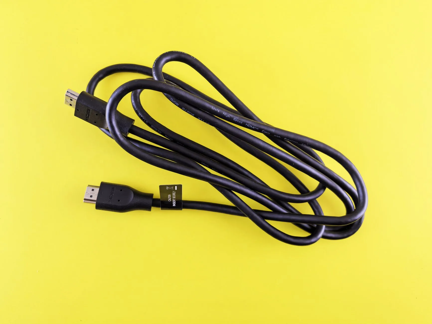 HDMI cable connected behind a home cinema television