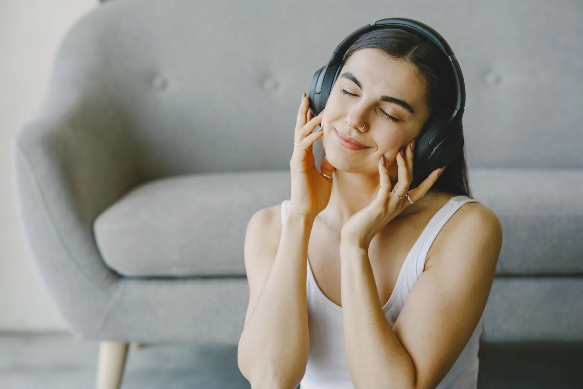Music lover enjoying wireless over-ear headphones at home